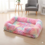 Happy Animalia plush pet bed with raised edges in pastel tie-dye colors, soft and calming for dogs and cats.