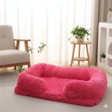 Happy Animalia plush dog and cat bed in bright pink, with raised edges for comfort and security. Soft, fluffy material.