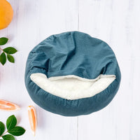 Happy Animalia teal orthopedic dog bed with plush lining and raised edges for comfort and support.