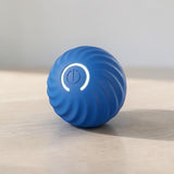 Happy Animalia blue automatic smart ball for dogs with swirling texture and power button light.