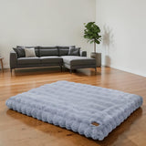 Happy Animalia light blue plush pet bed with a textured surface and a small leather tag.